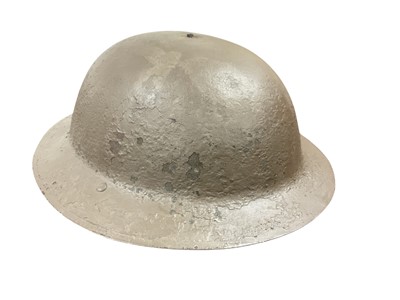 Lot 752 - First World War Mark I British Officer's steel helmet with later painted camouflage paint, interior with original liner.