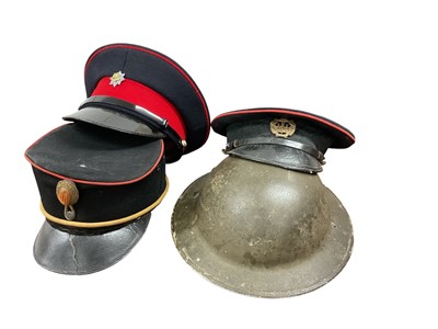 Lot 754 - Second World War Mark II British steel helmet, stamped 1940 under the brim, with original liner, together with a Kepi and two other military hats, (4).