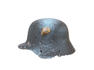 Lot 755 - First World War Imperial German M16 helmet in relic condition, with note of provenance regarding its discovery in 2015.