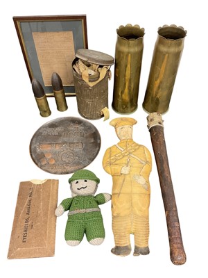Lot 761 - Group of Militaria to include a pair of First World War brass Trench Art vases, gas mask in canister and a cloth doll in British military uniform, (1 box).