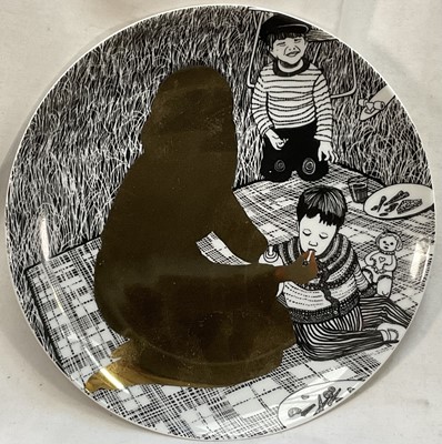 Lot 849 - *Sir Grayson Perry CBE, RA (b.1960-), Julie as a Mother of Two porcelain plate, printed with a design depicting the gold silhouette of Julie Cope with her two children on a picnic blanket, print...
