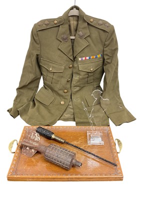 Lot 765 - Group of Militaria to include a 1960s Essex Regiment Lieutenants service dress jacket, wooden camp, dummy bomb and other items, (1 box).