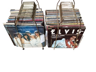 Lot 2232 - Two racks of LP records, including John Lennon. Madness, Blondie, Wings, Isaac Hayes, Nancy Sinatra, and Elvis Presley, conditions vary