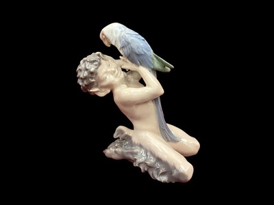 Lot 1212 - Royal Copenhagen porcelain figure - Fawn with parrot, model no. 752