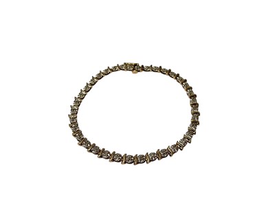 Lot 55 - 9ct gold diamond set bracelet in illusion setting, 18.5cm long