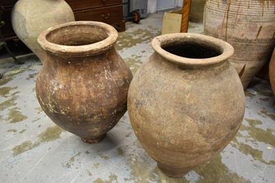 Lot 1242 - Two similar olive oil jars