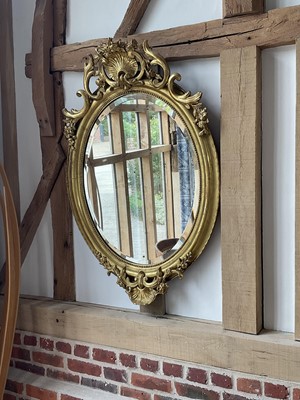 Lot 5393 - Oval giltwood wall mirror.