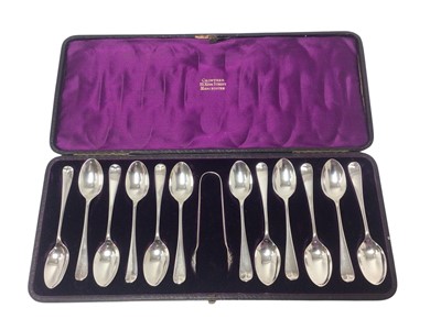 Lot 298 - Victorian cased set of twelve silver Hanoverian pattern teaspoons and sugar tongs, in purple velvet and silk lined tooled leather fitted box retailed by Crowther, Manchester, (London 1880)