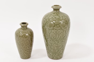 Lot 78 - Two Chinese celadon glazed vases, with carved decoration