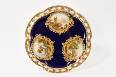 Lot 75 - Coalport plate, with pierced border, finely painted with landscapes, circa 1855