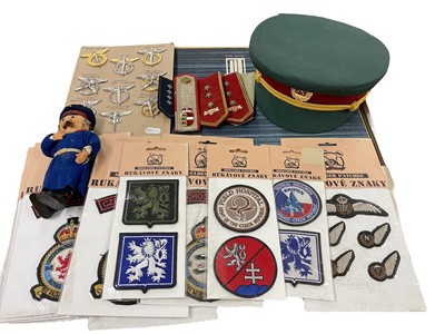 Lot 818 - Collection of Soviet era Czechoslovakian military ephemera, hats, doll and other items, (1 box).