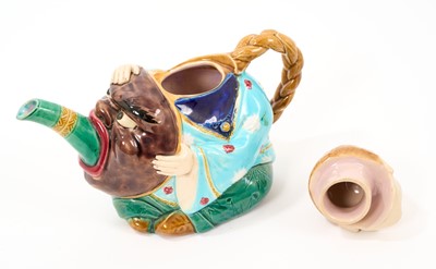Lot 56 - Minton majolica teapot and cover, in the form of a seated Chinaman, circa 1880