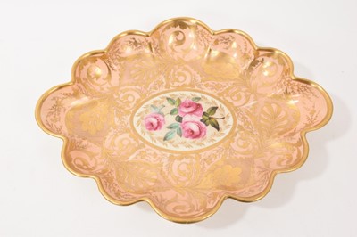 Lot 66 - Derby lobed oval dish, painted with pink roses, on a salmon and gilt ground, circa 1815