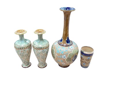 Lot 1283 - Pair of Doulton vases, together with a larger vase and a beaker with silver rim (4)
