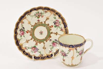Lot 104 - Worcester fluted coffee cup and saucer, painted with flower festoons, circa 1772