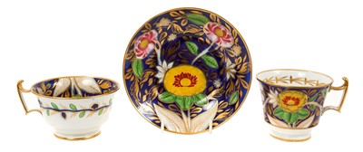 Lot 93 - Coalport London Shape trio, boldly painted on a blue ground, circa 1815