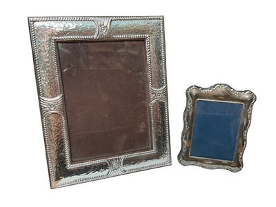 Lot 135 - Silver (925) photograph frame with hammered finish and flower head decoration, together with a smaller silver photograph frame (Sheffield 1991)