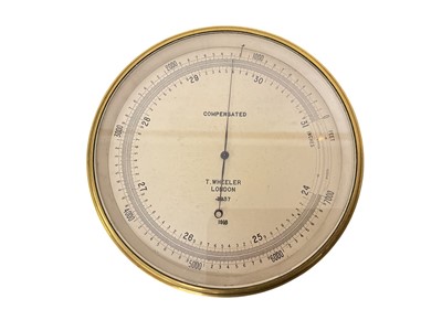Lot 834 - First World War British military issue bulkhead barometer, in lacquered brass case with silvered dial, named T. Wheeler, London, 3937, 1918, rear of case marked with broad arrow.