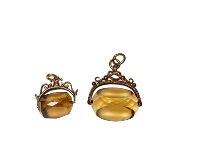 Lot 139 - Two 9ct gold mounted citrine and smoky quartz rotating seal fobs