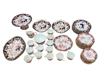 Lot 1298 - Crown Derby Imari pattern tea and dinner wares, including 7 plates, 3 oval dishes, 2 fan shaped dishes, cake stand, 13 tea plates, 13 saucers, 12 cups, 1 jug, 1 sugar bowl