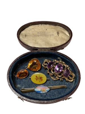 Lot 160 - Victorian gilt metal and amethyst three stone brooch, two citrine pendants in yellow metal mounts, Norwegian silver enamel polar bear tie clip and one other brooch