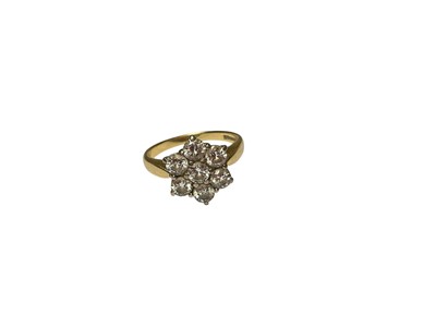 Lot 175 - Diamond seven stone flower head cluster ring in 18ct gold setting