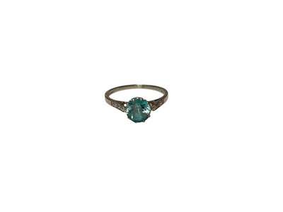 Lot 184 - 1930s blue zircon single stone ring with diamond set shoulders on platinum shank