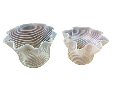 Lot 2602 - Two Victorian Vaseline glass oil lamp shades with handkerchief borders and swirl decoration 14-15.5 cm high