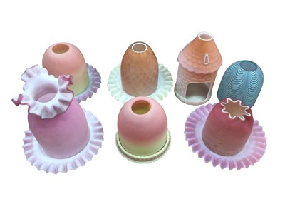 Lot 2606 - Two Victorian Burmese satin glass shades with S.Clake Patent base and other satin glass tea light shades and bases (12)