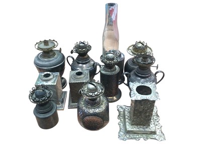 Lot 2609 - Eleven late Victorian and Edwardian silver plated small oil table lamp bases