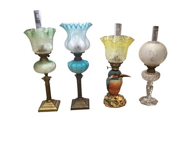 Lot 2610 - Unusual Victorian novelty Kingfisher oil lamp base with encrusted decoration and yellow tinted etched shade 41cm high and three other Victorian oil lamps with shades (4)