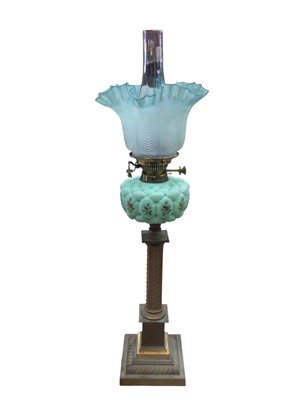 Lot 2612 - Victorian brass and turquoise coloured and floral painted glass oil lamp with blue tinted satin glass shade with handkerchief border 28cm high