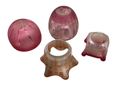 Lot 3037 - Two Victorian ruby glass oil lamp shades with etched decoration, amber shaded and one other (4)