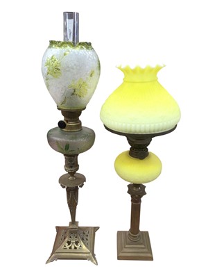 Lot 2626 - Three Victorian brass columned oil lamps with tinted reservoirs and shades and pink glass ditto (4)
