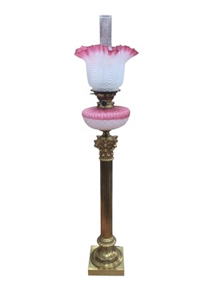 Lot 2631 - Fine Victorian oil lamp with brass Corinthian column base, ruby trailed diamond quilted satin glass reservoir with similar shade with handkerchief border 101cm high