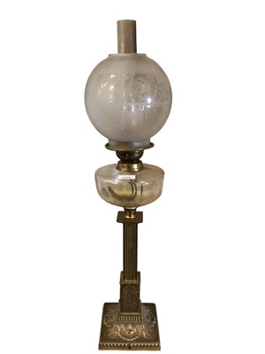 Lot 2646 - Edwardian brass oil lamp with glass reservoir and etched glass globe 78cm high