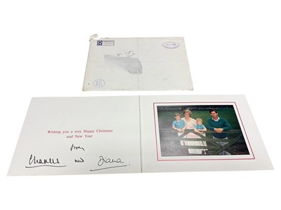 Lot 32 - T.R.H. The Prince and Princess of Wales, signed 1989 Christmas card with twin gilt Royal cyphers to cover, colour photograph of the relaxed Royal couple with the young Princes resting on a gate...