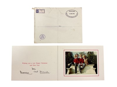 Lot 33 - T.R.H. The Prince and Princess of Wales, signed 1990 Christmas card with twin gilt Royal cyphers to cover, colour photograph of the relaxed Royal couple with the young Princes resting on a marbl...