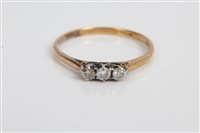 Lot 3372 - Diamond three stone ring on yellow metal shank....