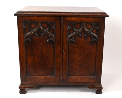 Lot 728 - 19th century Gothic oak table cabinet, enclosed by pair of tracery panel doors on ogee bracket feet, 46cm wide x 28cm deep x 46cm high