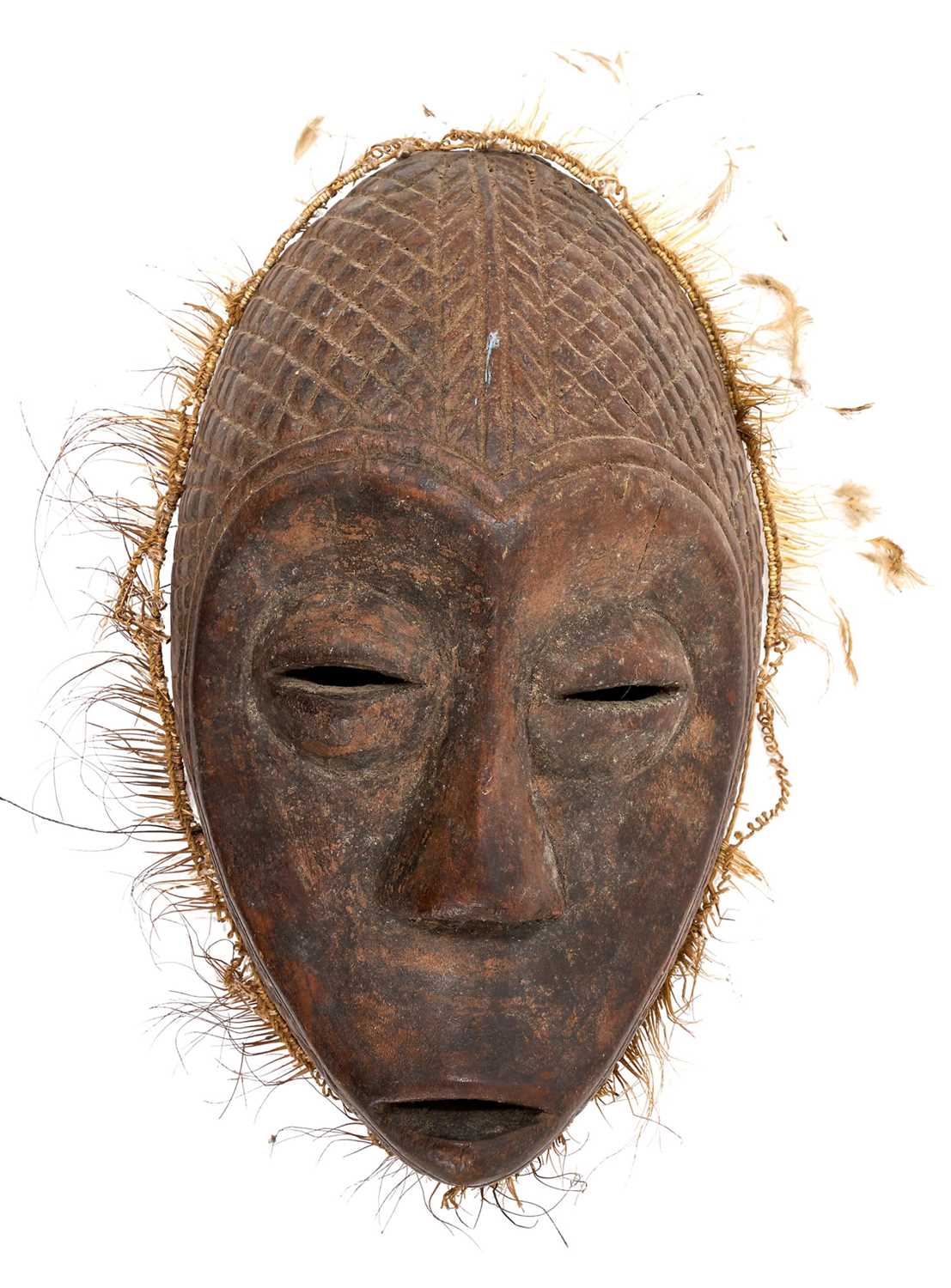Lot 749 - Tribal mask, Congo, carved feature and diaper ornament, 34cm high