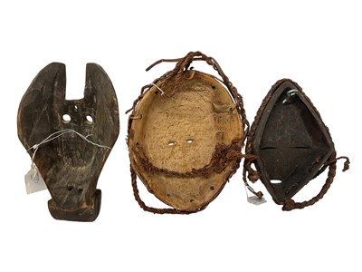 Lot 752 - Dan tribal mask, with woven hair, 25cm high, and two further tribal masks - Guatemalan animal mask and Fang painted mask