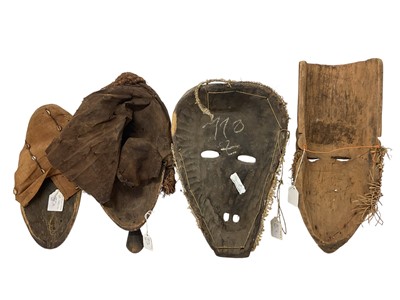 Lot 753 - Four African tribal masks, including a Kuba mask with shell, cloth and bead ornament, Yoruba mask, Fang mask and a polychrome painted Basonge mask. (4)