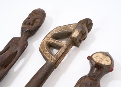 Lot 757 - Tribal ceremonial spoon, Gabon, with figural handle, 23cm long, together with a Baule gong beater and Nigerian figural spoon. (3)
