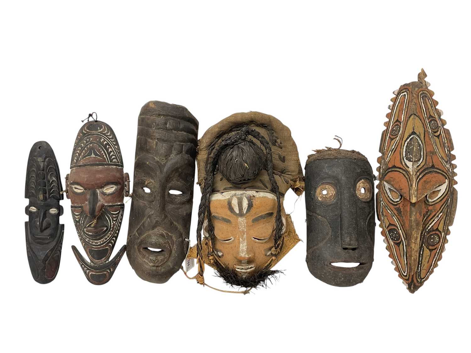 Lot 760 - Six tribal masks, including Sepik river masks, Zaire, one claimed to be Congo mask from a Pygmy tribe, polychrome Bapende mask and one other unidentified. (6)