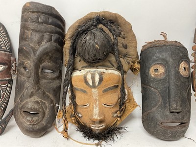 Lot 760 - Six tribal masks, including Sepik river masks, Zaire, one claimed to be Congo mask from a Pygmy tribe, polychrome Bapende mask and one other unidentified. (6)