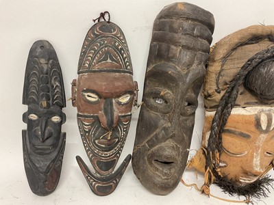 Lot 760 - Six tribal masks, including Sepik river masks, Zaire, one claimed to be Congo mask from a Pygmy tribe, polychrome Bapende mask and one other unidentified. (6)