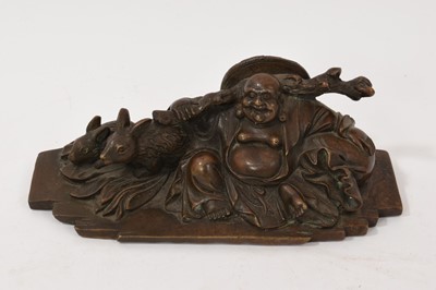 Lot 762 - Chinese bronze figure of a laughing Buddha, seated with attendant rabbits, 16cm long