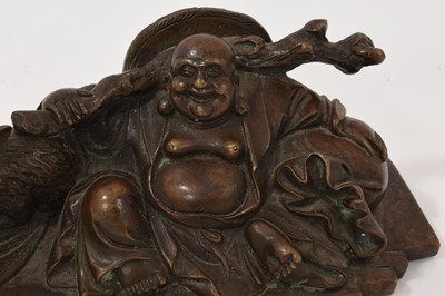 Lot 762 - Chinese bronze figure of a laughing Buddha, seated with attendant rabbits, 16cm long
