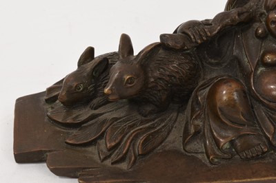 Lot 762 - Chinese bronze figure of a laughing Buddha, seated with attendant rabbits, 16cm long